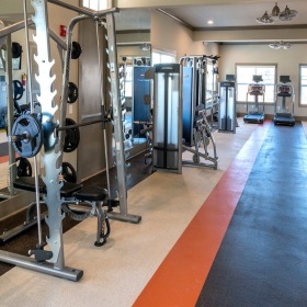 fitness center with equipment, treadmills and spacious areas